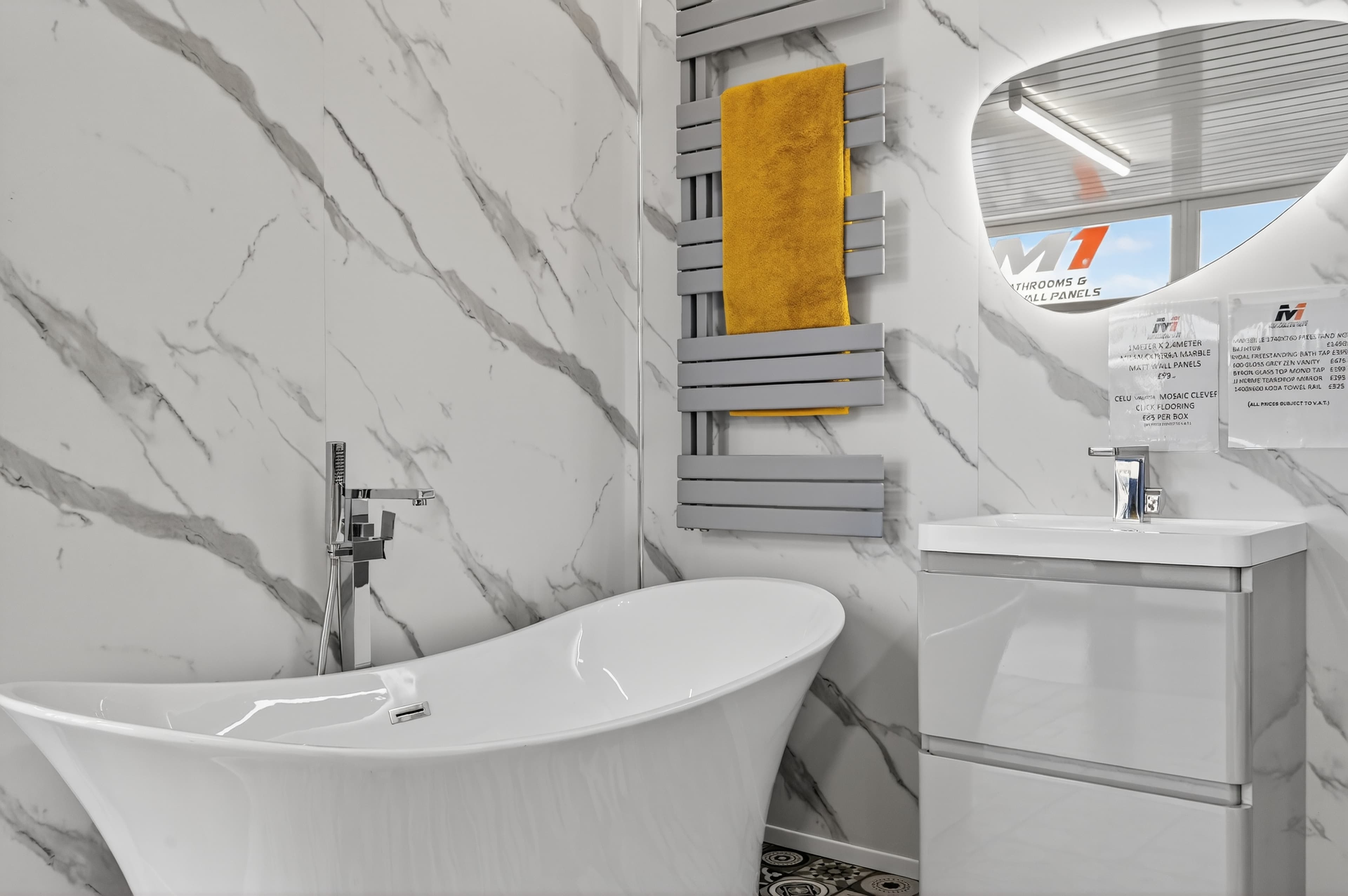 Marble-effect PVC wall panels with freestanding bath, grey vanity unit and heated towel rail - bathroom trade supplies Belfast M1 Bathrooms