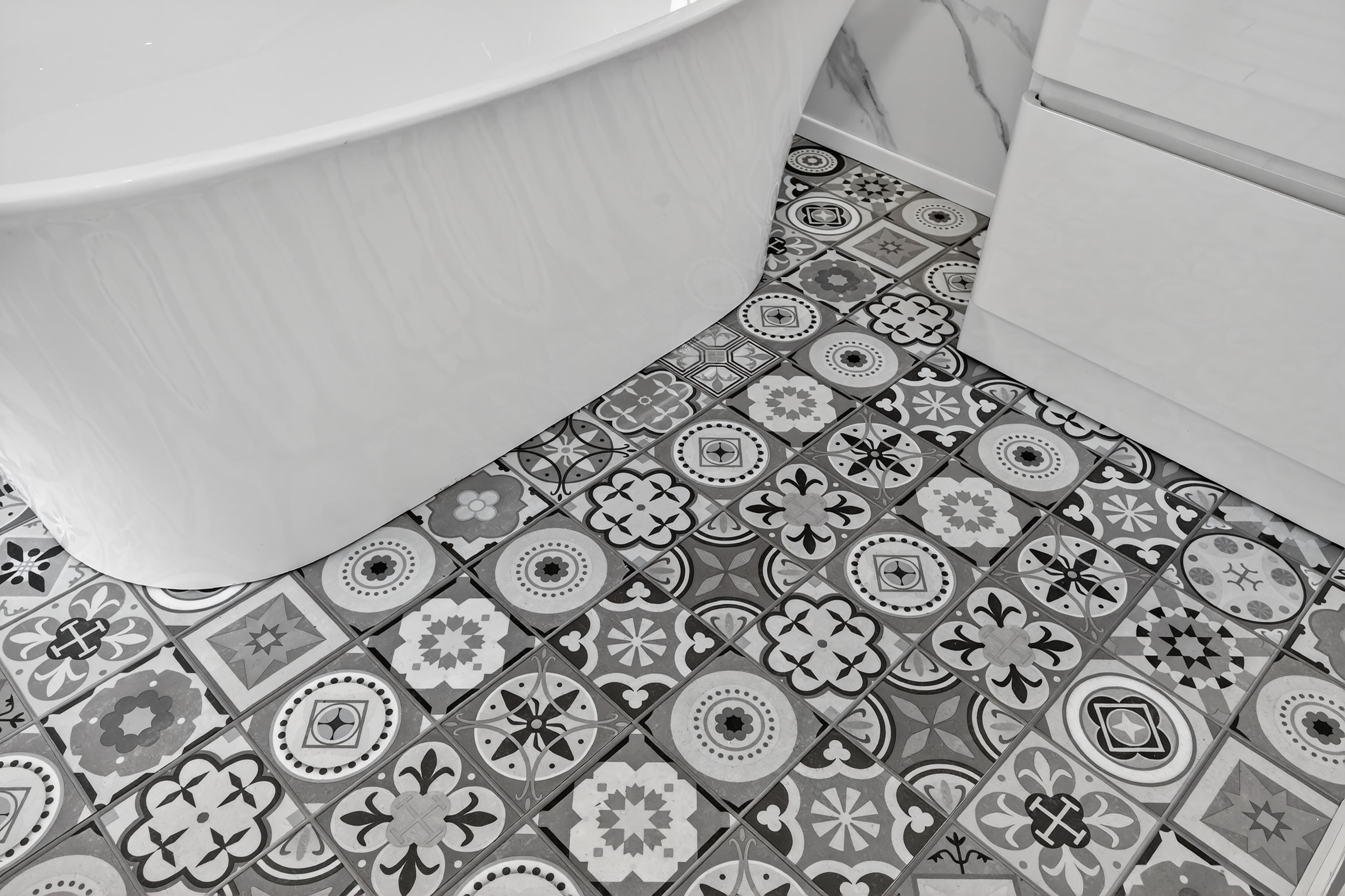 Patterned mosaic-effect click flooring with freestanding bath - bathroom trade supplies Belfast M1 Bathrooms