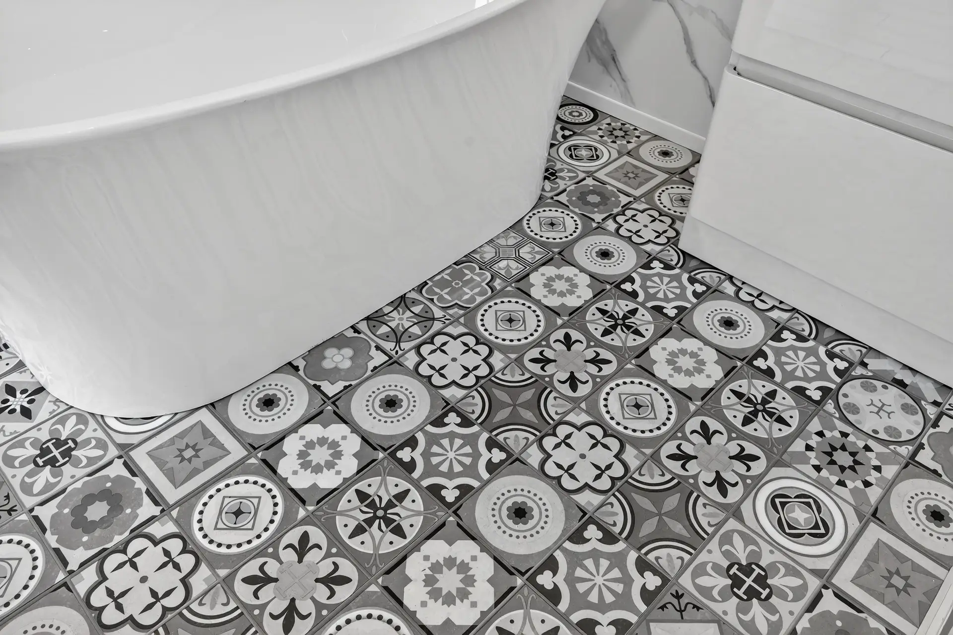 Patterned mosaic-effect click flooring with freestanding bath - bathroom trade supplies Belfast M1 Bathrooms